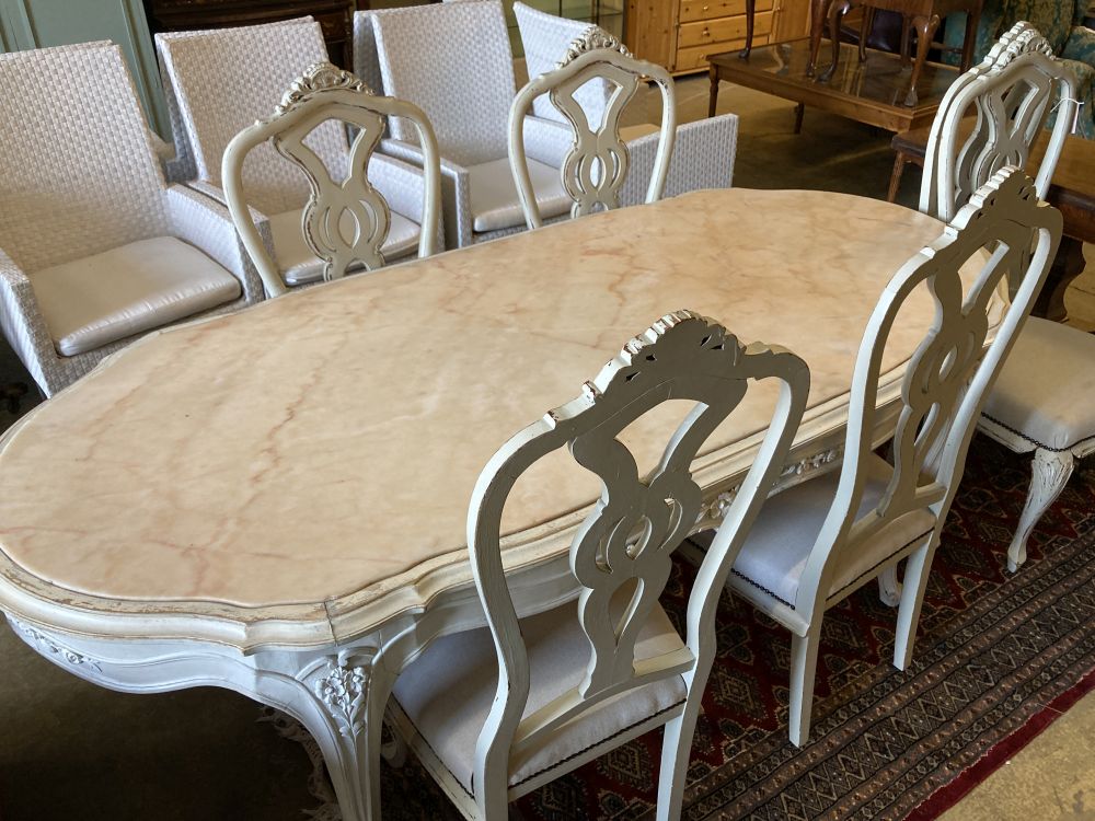 A Louis XV-style cream painted dining table, width 204cm, depth 90cm, height 76cm and six chairs